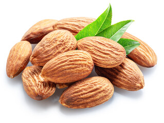Pile of shelled almond nuts with almond leaves isolated on white background. File contains clipping path.