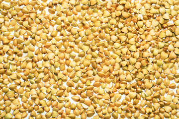 Hulled kernels of buckwheat grains close up. Food background.