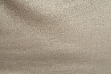 Macro texture of dark khaki smooth leather closeup. Production and fashion background.