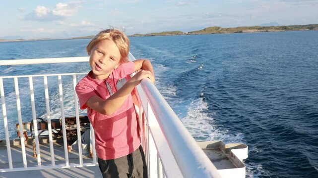 People, enjoying ferry ride between Bodo and Lofoten Moskenesoya summertime, child and adults on a ferry