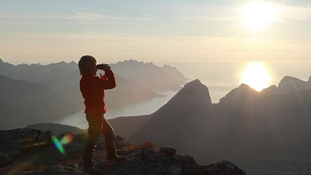 Children and adults, family with dog, hiking Grytetippen trail in Senja, Lofoten on a sunny hot summer day