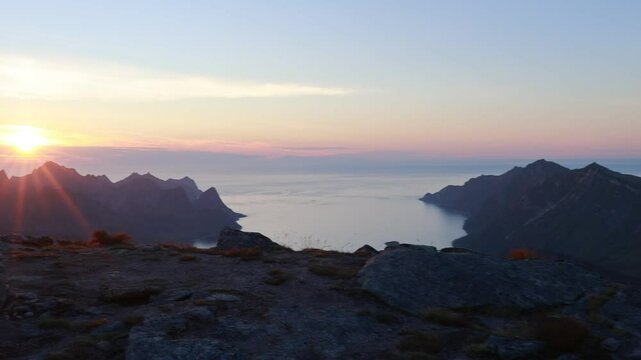 Children and adults, family with dog, hiking Grytetippen trail in Senja, Lofoten on a sunny hot summer day