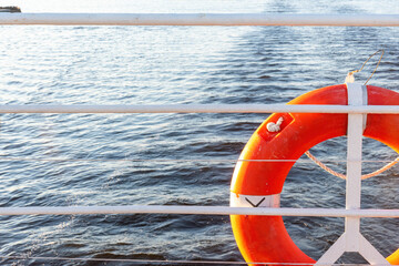 lifebuoy hanging on stern railings of vessel