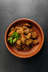 Traditional homemade roasted meat with onions and greens, food photography and culinary blogs