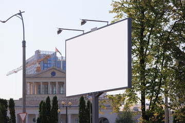 Background for design. Advertising billboard along the road in the city on a sunny day