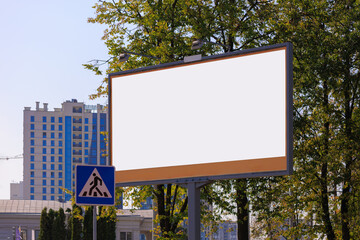 Background for design. Advertising billboard along the road in the city on a sunny day