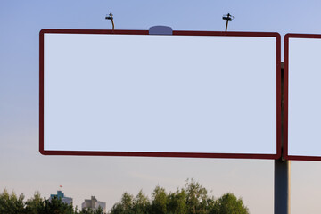 Background for design. Advertising billboard along the road in the city on a sunny day