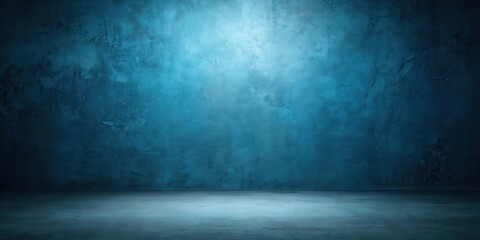 A dimly lit room with a textured blue wall and a concrete floor, creating a minimalist and atmospheric backdrop.