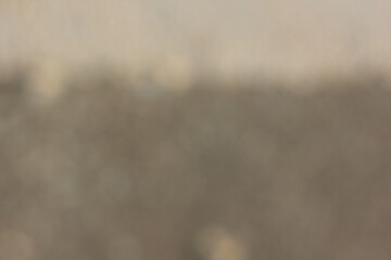 A vague view of a concrete sidewalk.