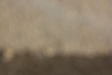 A vague view of a concrete sidewalk.