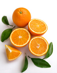 orange fruits with slices and green leaves, either whole or halved, isolated on a white background