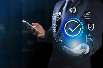 Businessman shows signs of quality assurance, guarantee, ISO certification, standardization...
