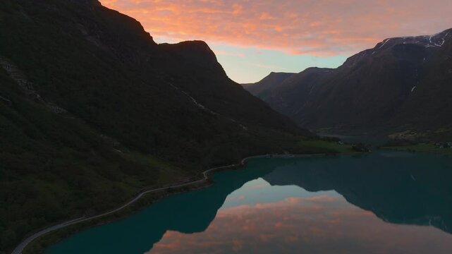 Oldevatnet lake at Briksdalsbreen glacier. Scenic Norway Scandinavia nature sunset water reflection