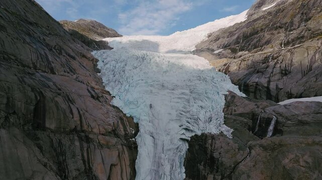 Briksdalsbreen Glacier in Norway, Briksdal, Scandinavia with thick ice. Epic mountain nature.