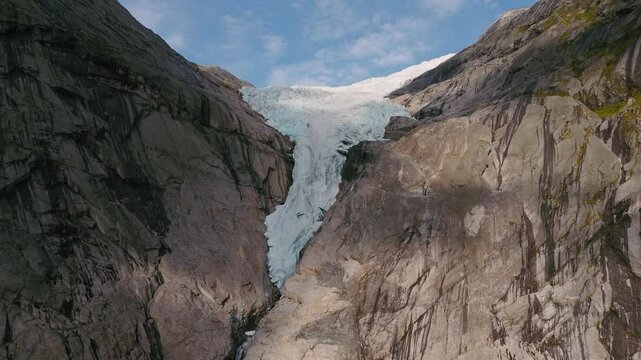 Briksdalsbreen Glacier in Norway, Briksdal, Scandinavia with thick ice. Epic mountain nature aerial.