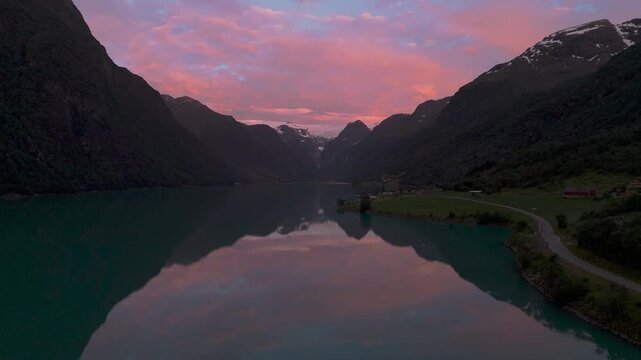 Oldevatnet lake at Briksdalsbreen glacier by sunset. Scenic Norway Scandinavia nature water reflection