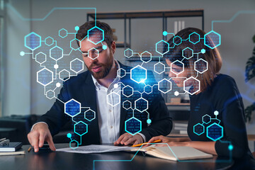 Business professionals analyzing data with digital graphics overlay.