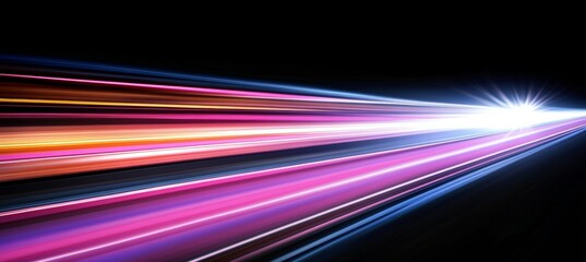 Colorful light trails with motion blur effect and long time exposure on a black background.