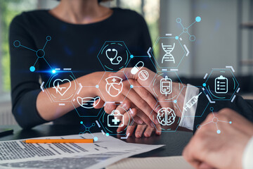Business handshake with medical icons and data visualization concept.