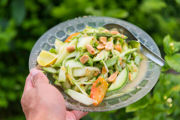 Young melon thai salad in white dish