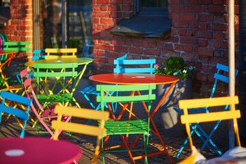 Colorful tables and chairs in an outdoor cafe or restaurant in Helsinki, Finland.