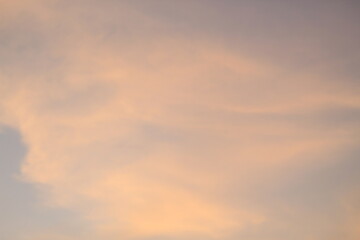 Obraz premium beautiful orange cloudy afternoon bright blue clouds, warm, sunset