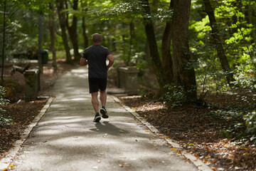 Athletic man running in park