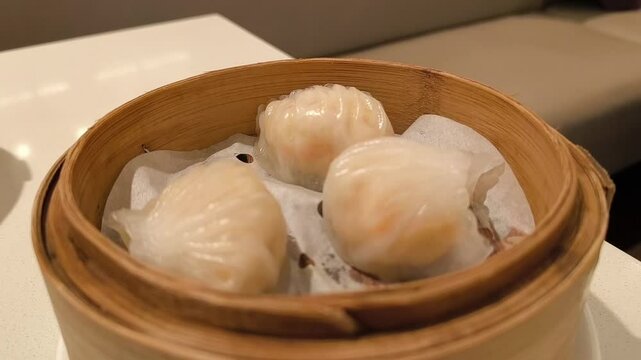 Steamed shrimp dumpling in bamboo steamer busket. Dimsum. Har gow. Chinese food
