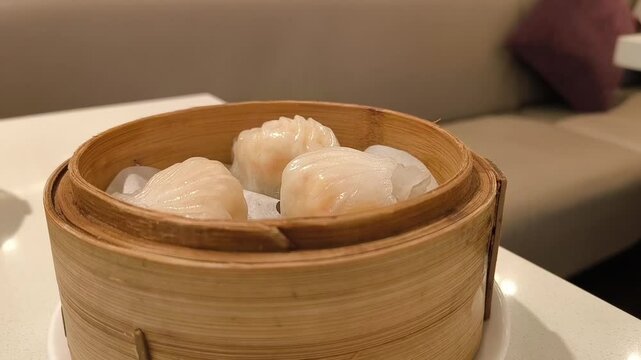 Steamed shrimp dumpling in bamboo steamer busket. Dimsum. Har gow. Chinese food