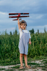Curious 5 Years Old Preschool Child Boy Plays Craft Wooden Retro Styled Airplane