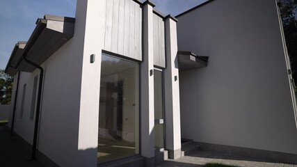 Modern Minimalist House Exterior with Elegant Glass, Blending Functionality and Aesthetics