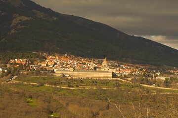 monastery and village at the base of a mountain