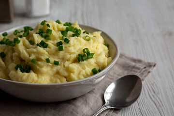 Homemade Chive and Garlic Mashed Potatoes in a Bowl, side view.