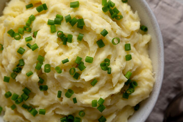 Homemade Chive and Garlic Mashed Potatoes in a Bowl, top view. Close-up.