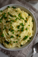 Homemade Chive and Garlic Mashed Potatoes in a Bowl, top view. Close-up.
