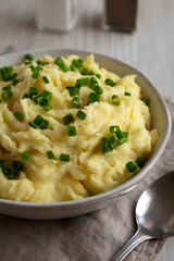 Homemade Chive and Garlic Mashed Potatoes in a Bowl, side view. Close-up.