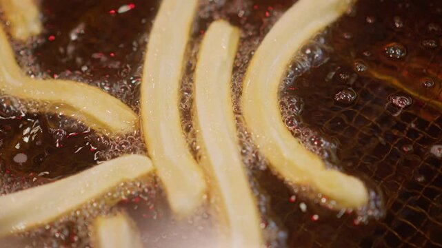 Churros that get turned in hot oil while baking