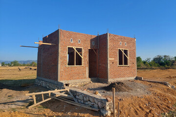 The process of building a permanent house uses red brick