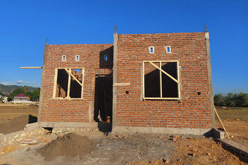 The process of building a permanent house uses red brick