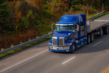 Heavy truck on a Canadian highway in the fall in Quebec