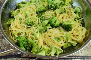 homemade spaghetti with broccoli and parmesan cheese