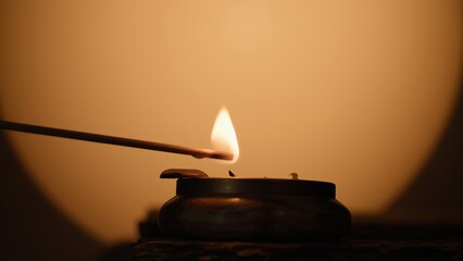 Faint Flame Diwali Candle In Silhouette