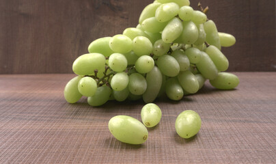 Natural organic different types of fresh ripe juicy grapes and space for text on table. top view, Agriculture concepts.