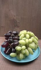 Natural organic different types of fresh ripe juicy grapes and space for text on table. top view, Agriculture concepts.
