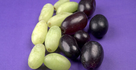 Natural organic different types of fresh ripe juicy grapes and space for text on table. top view, Agriculture concepts.
