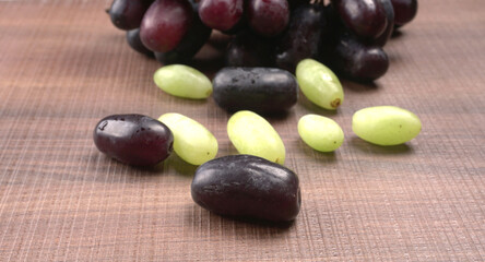 Natural organic different types of fresh ripe juicy grapes and space for text on table. top view, Agriculture concepts.