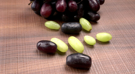 Natural organic different types of fresh ripe juicy grapes and space for text on table. top view, Agriculture concepts.