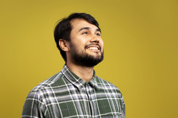 man in three-quarter front view smiling and looking up