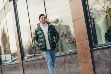 Photo of good mood cheerful man dressed trendy clothes walking exploring new city pastime spring day outdoors © deagreez