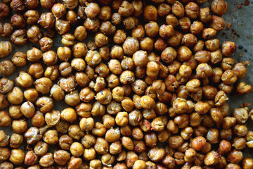 Sheet pan with homemade roasted chickpeas. Top view.